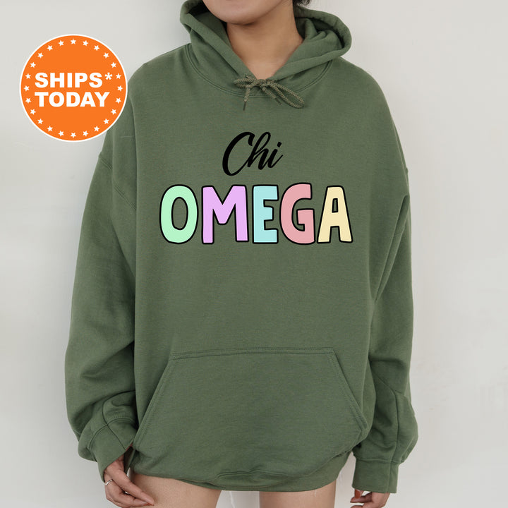 a woman wearing a green hoodie that says chi omega