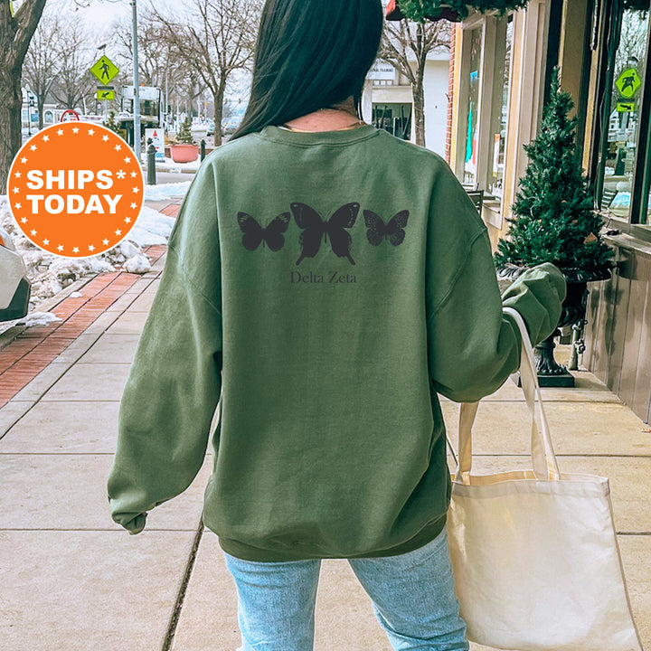 a woman walking down a sidewalk carrying a bag