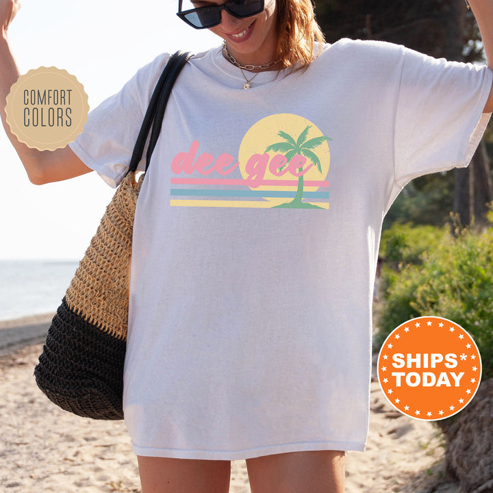 a woman wearing a white shirt with a palm tree on it