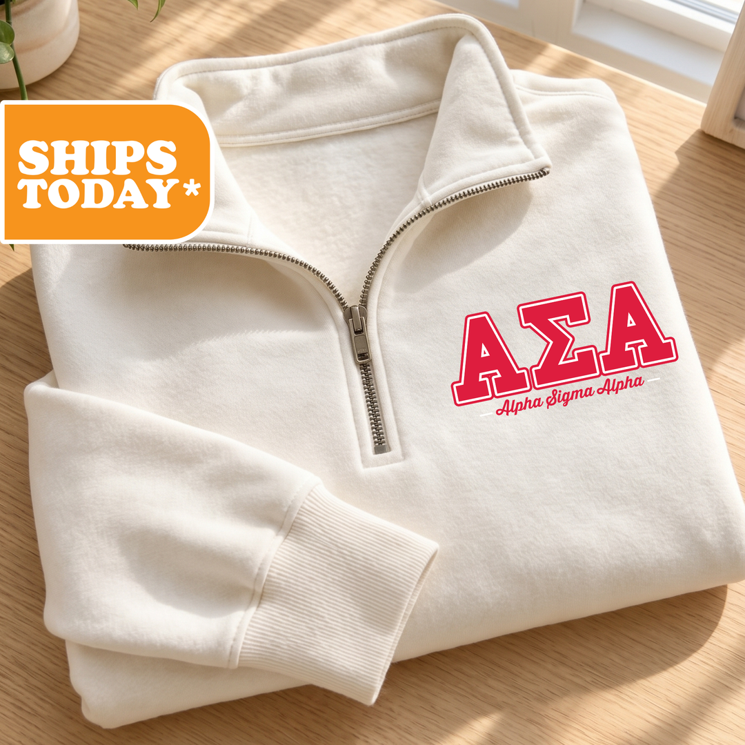 A white zip-up jacket with the Greek letters 'ΑΕΛΑ' (Alpha Delta Sigma) printed on it, along with the text "αΕΛΑ ΜΕΑΣ ΑΕΛΑ ΚΑΙΑ" (Delta Sigma Alpha). The jacket is displayed on a wooden surface, and there is a shipping label with the text "SHIPS TODAY" and "*" indicating that the image is a product listing.