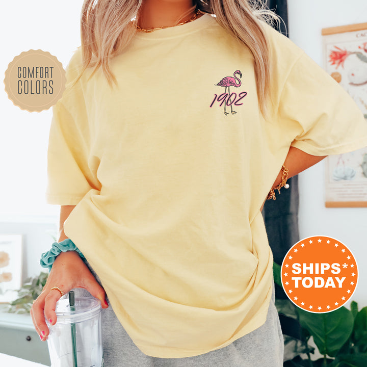 a woman wearing a yellow shirt with a pink flamingo on it