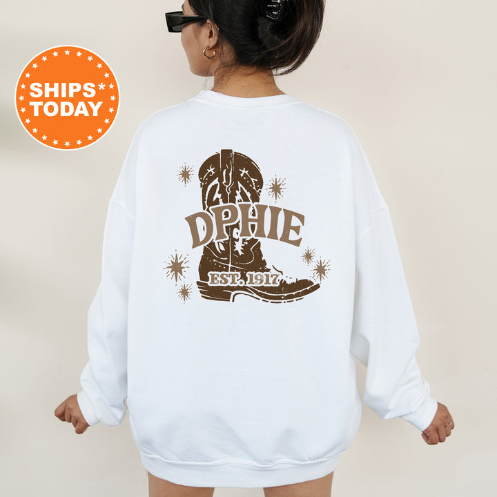 a woman wearing a white sweatshirt with a cowboy boot on it