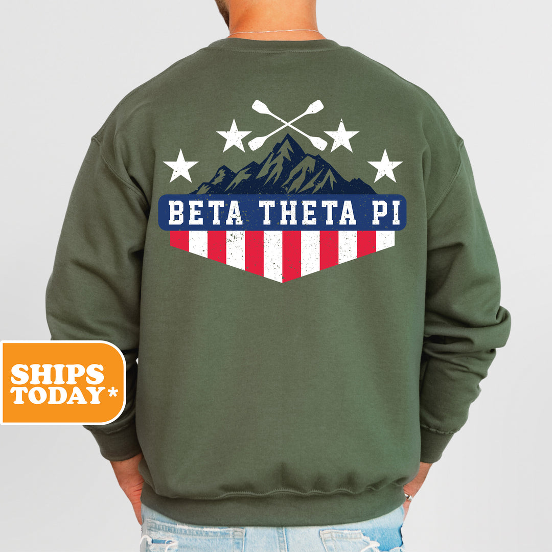 a man wearing a green sweatshirt with the words beta thea pi on it