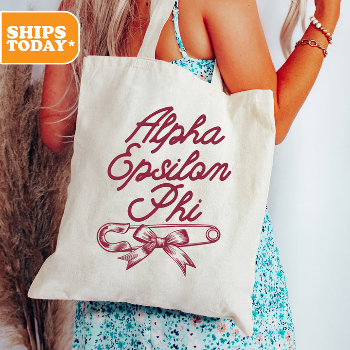 a woman holding a tote bag with a message on it