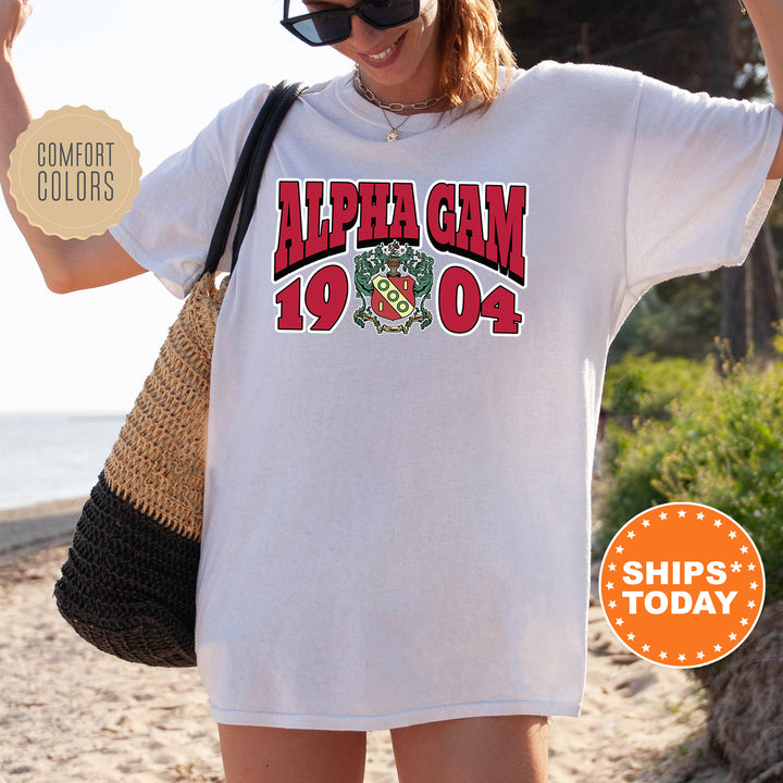 a woman wearing a white shirt with the words alpena gam on it