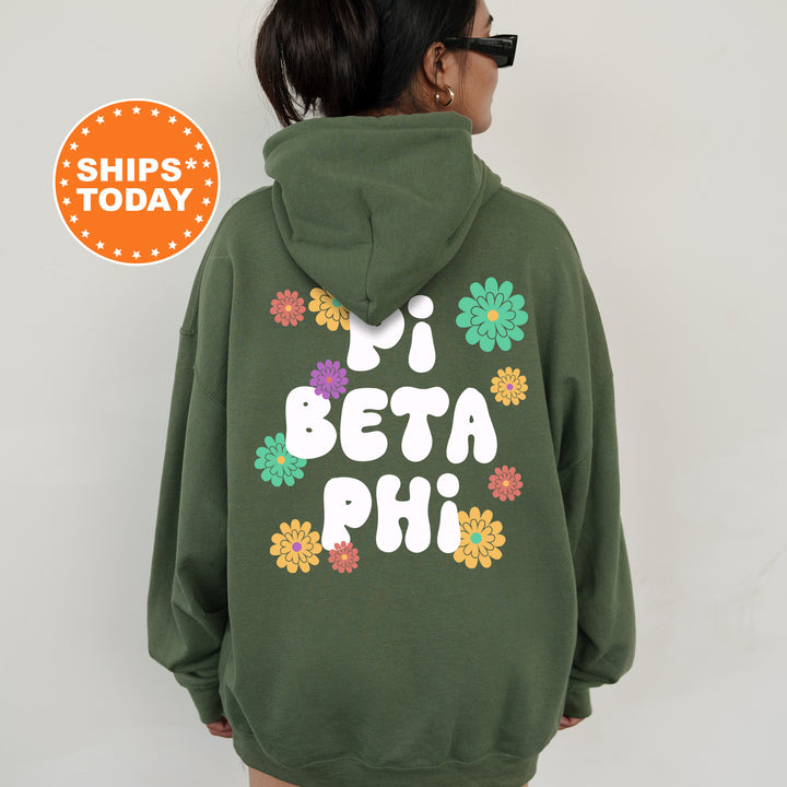 a woman wearing a green hoodie that says pi beta phi