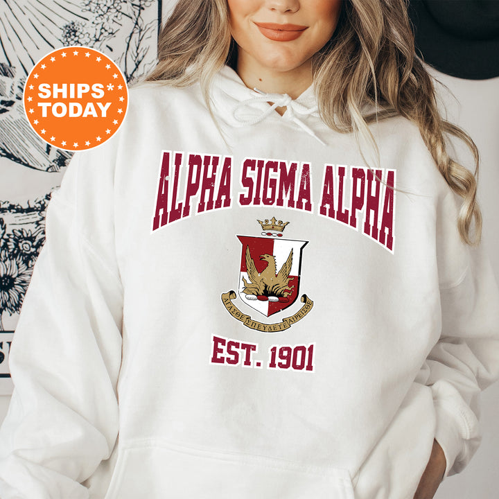 a woman wearing a white hoodie with the words alpa sisma alpa