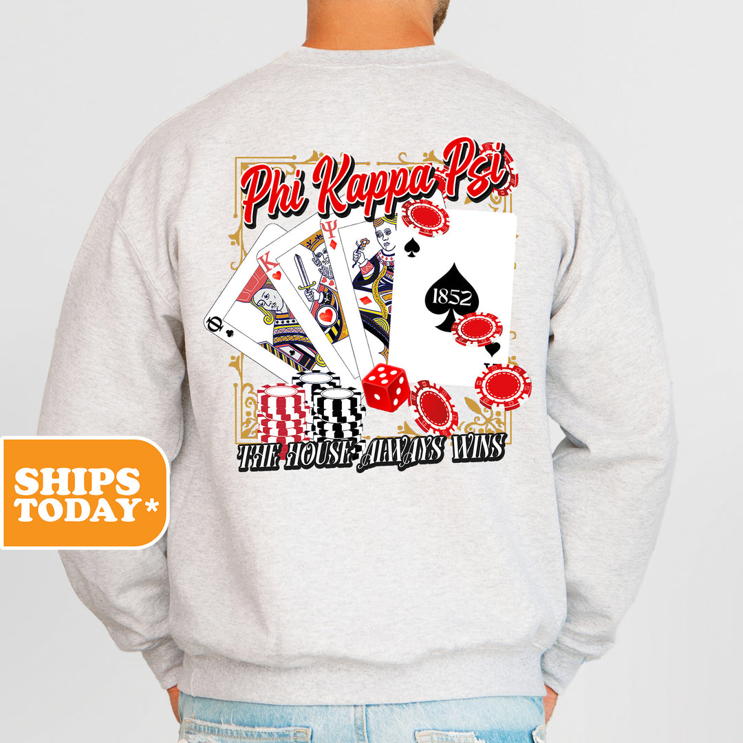 a man wearing a sweatshirt with a picture of playing cards on it