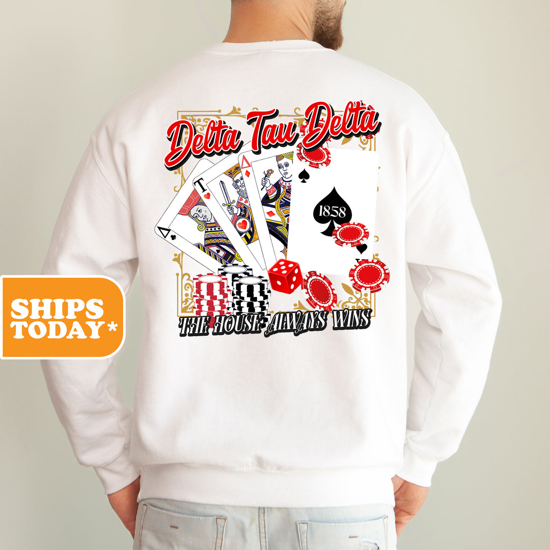 a man wearing a white sweatshirt with a picture of a deck of cards on it