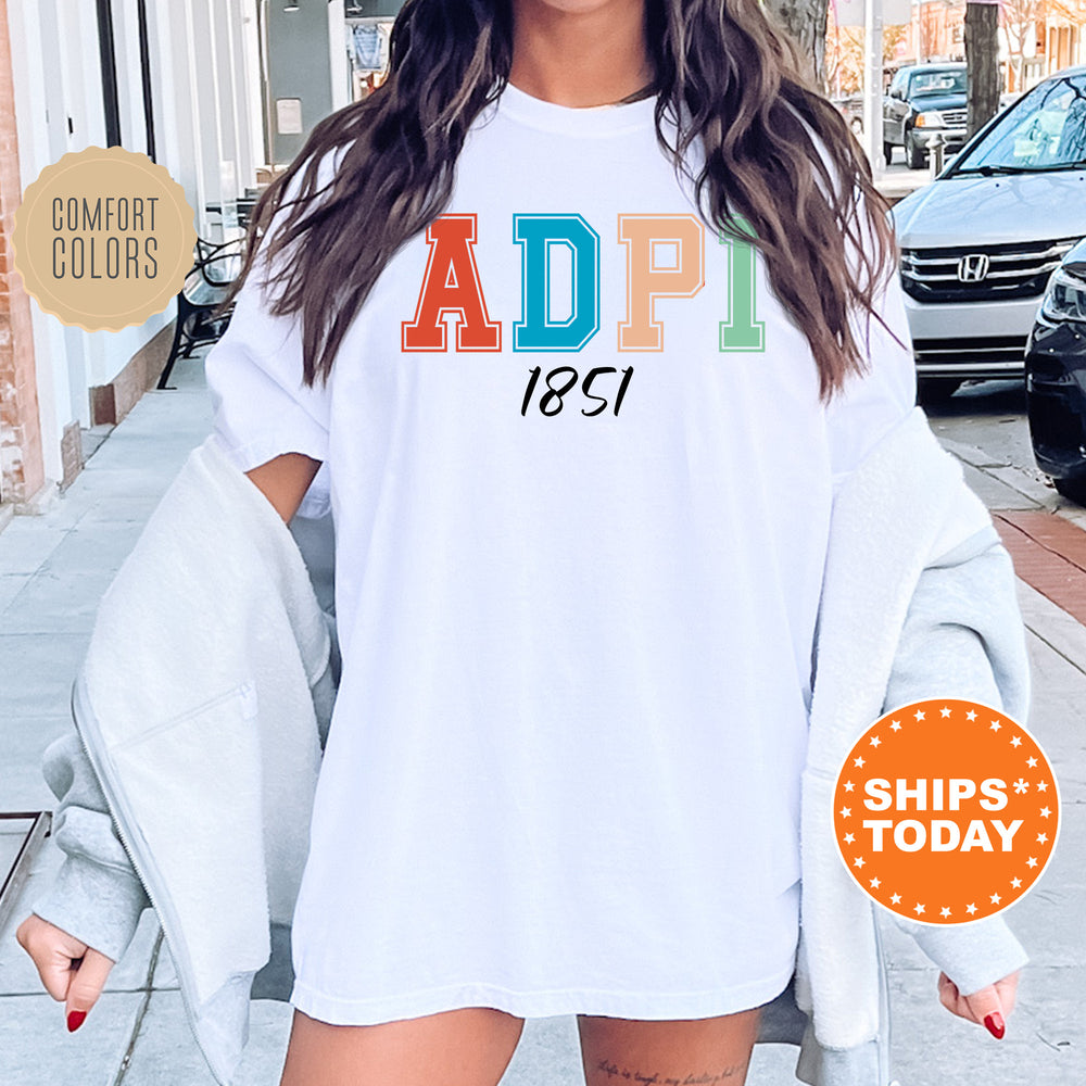 a woman wearing a white shirt with the word adopt printed on it