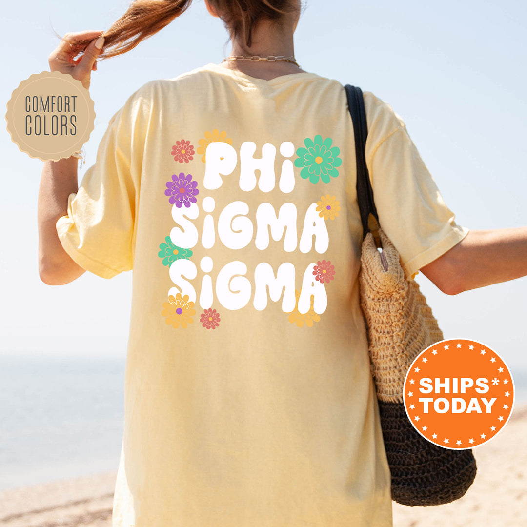 a woman walking on the beach with a t - shirt saying phi sigma