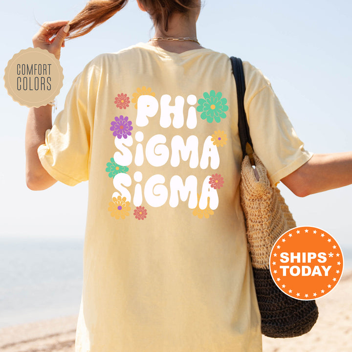 a woman walking on the beach with a t - shirt saying phi sigma