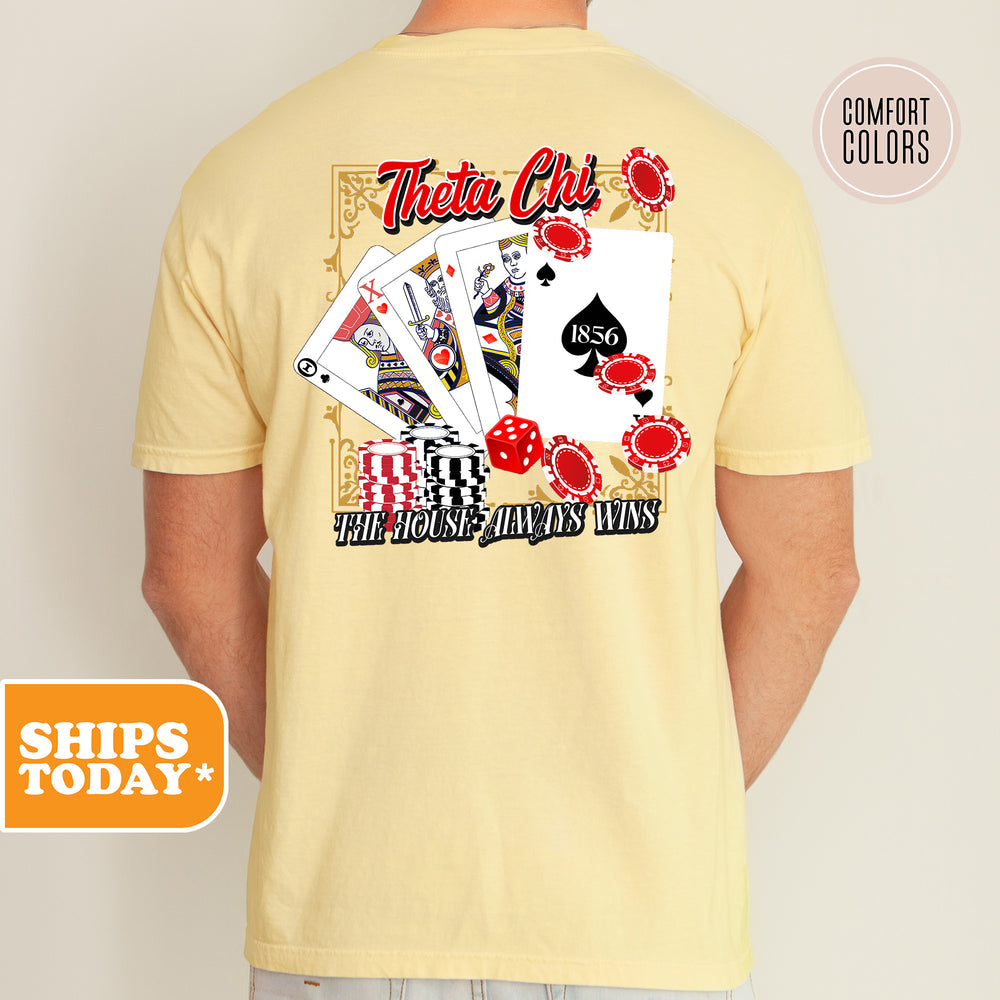a man wearing a t - shirt with a picture of playing cards on it