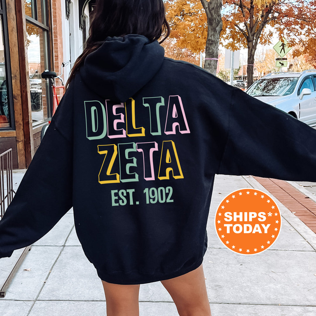 a woman in a black hoodie is walking down the street