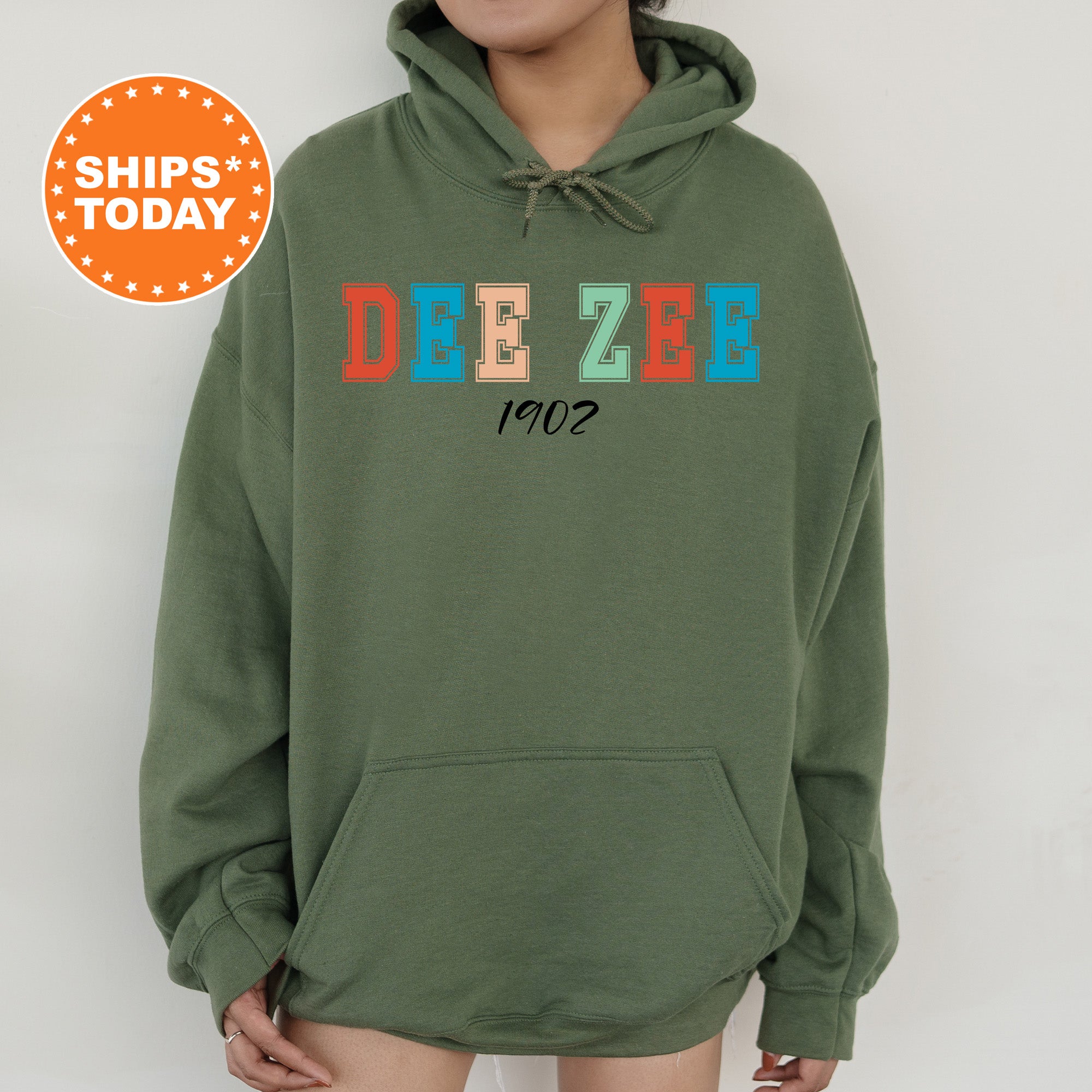 a person wearing a green hoodie with the word dezeb on it