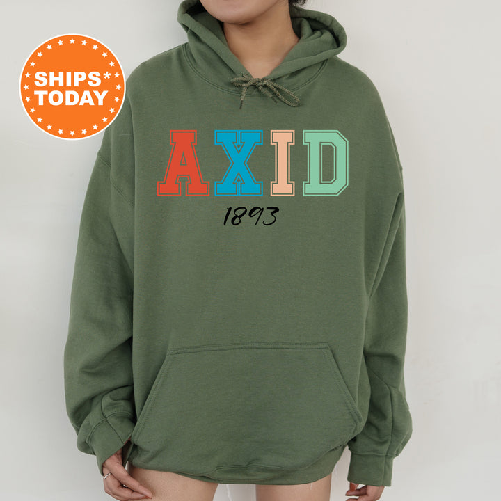 a woman wearing a green hoodie with the word axid printed on it
