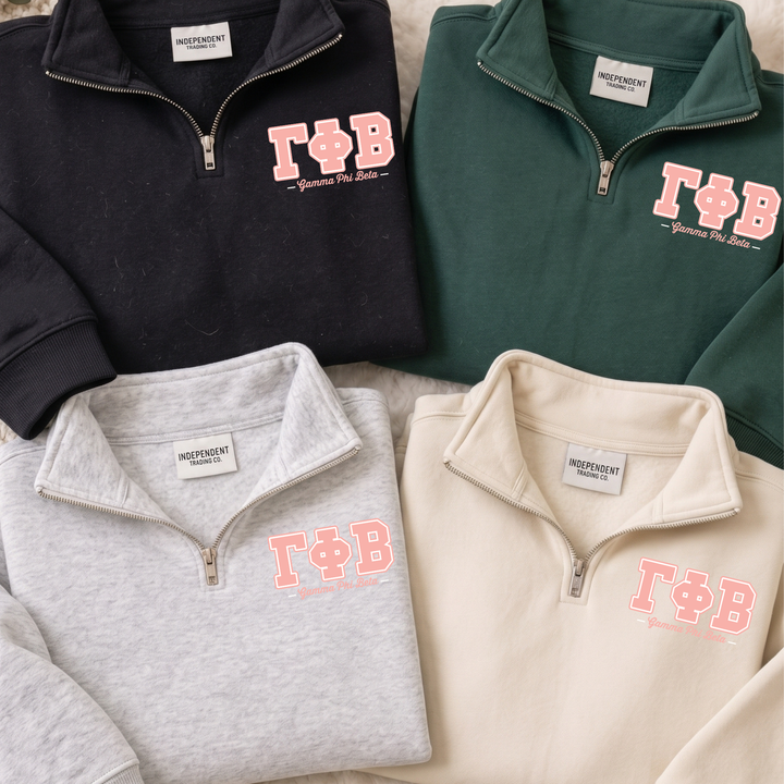 a collection of four different colored zip-up sweatshirts, each with the Greek letters "ΦΑΓΟ" printed on them.