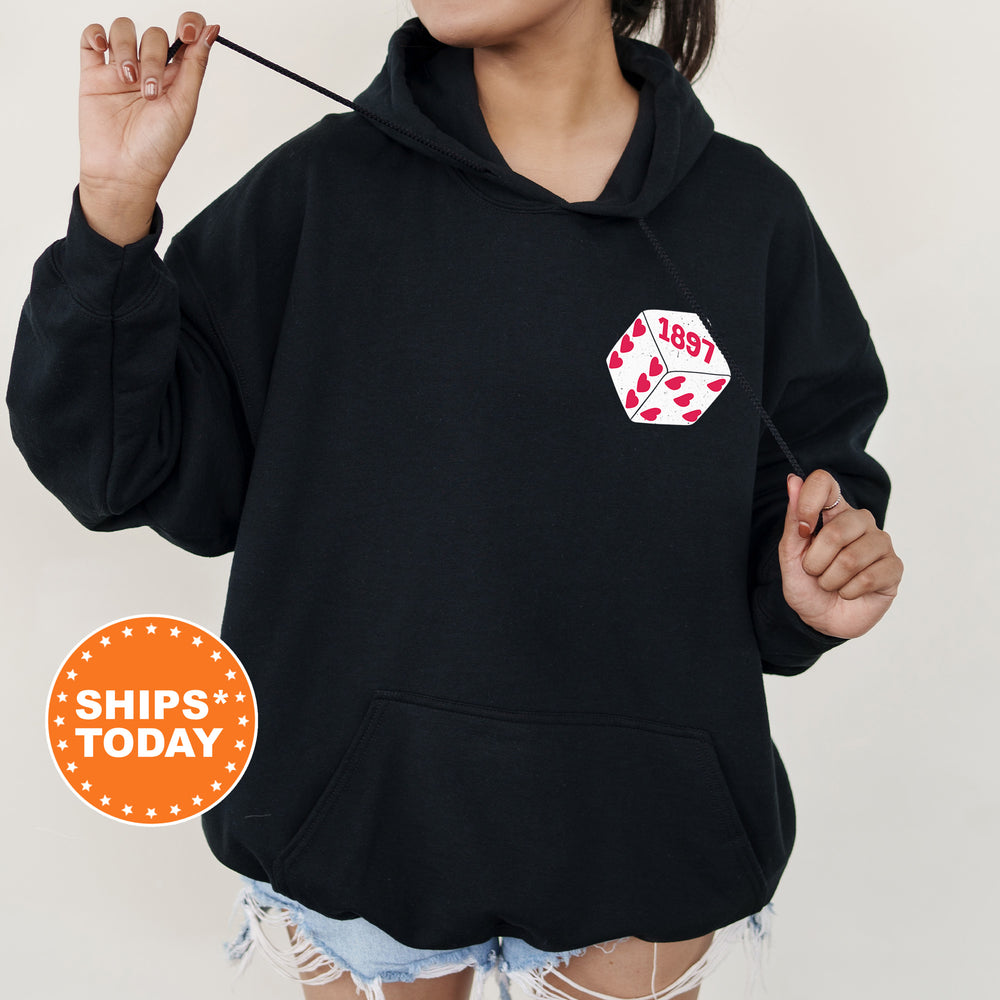 a woman wearing a black hoodie with a sticker on it