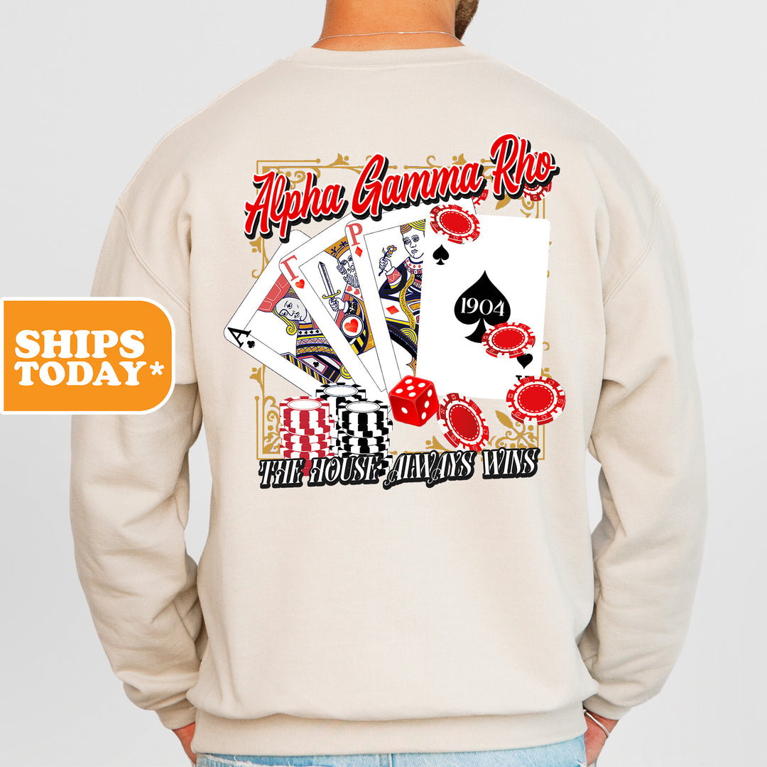 a man wearing a sweatshirt that has a picture of playing cards on it