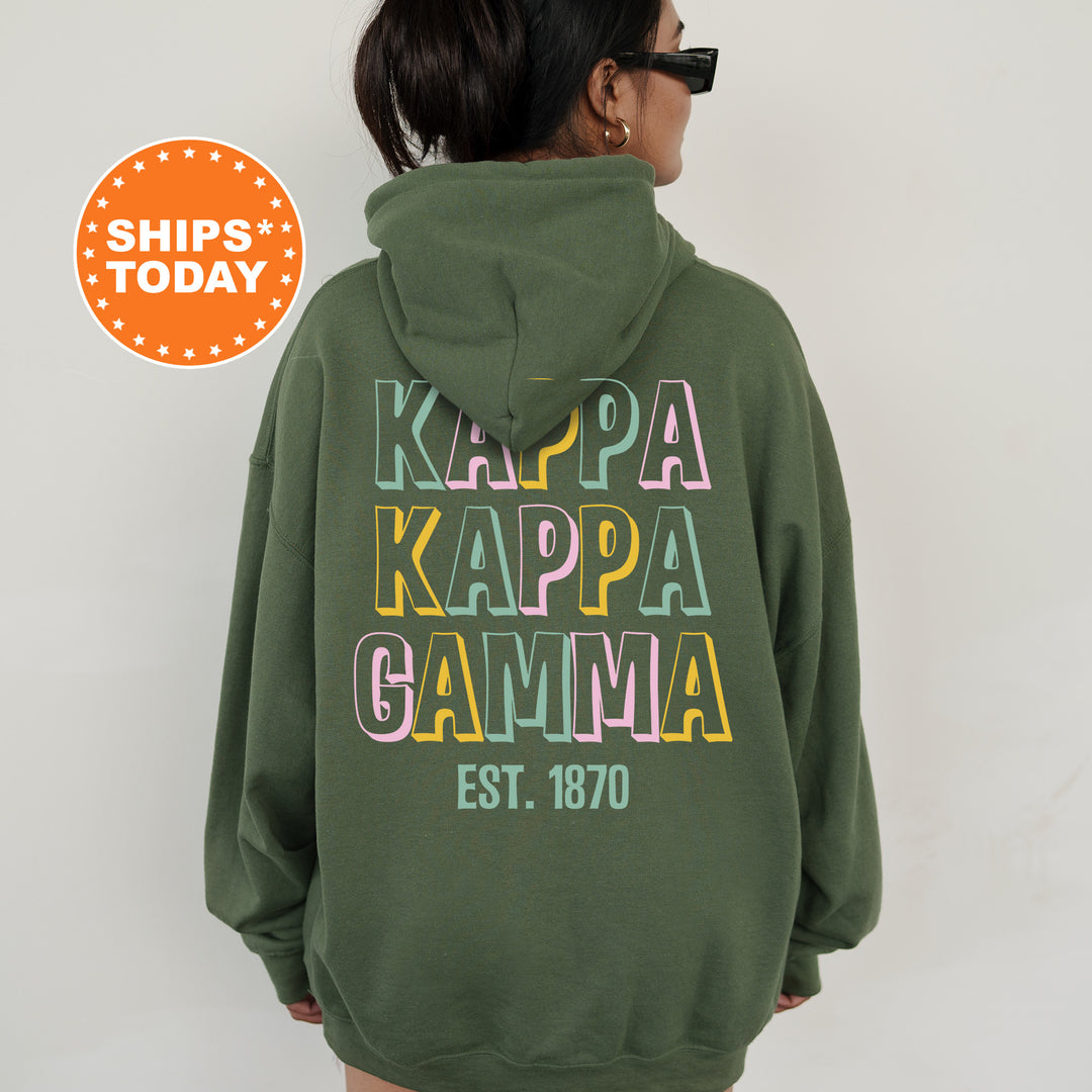 a woman wearing a green hoodie with the words kalpa kappa