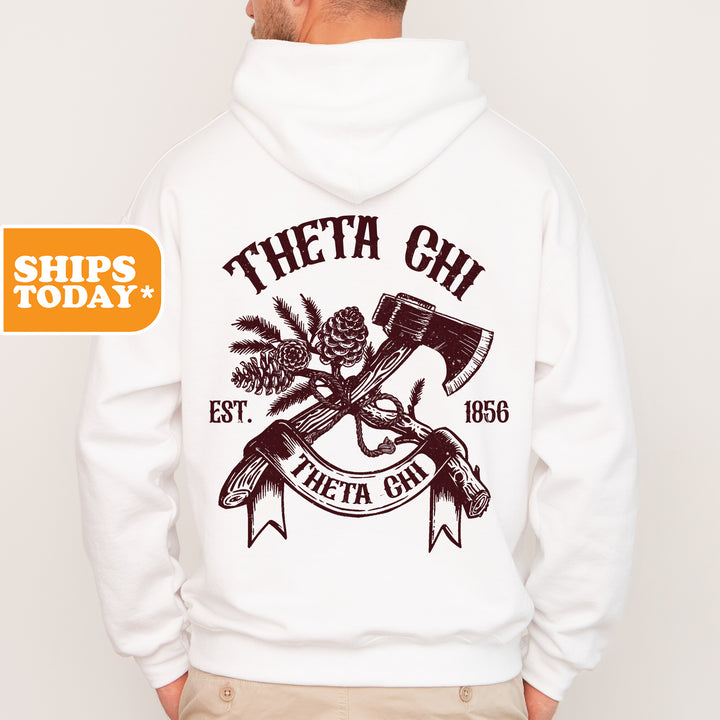 a man wearing a white hoodie with a hammer and pine tree on it