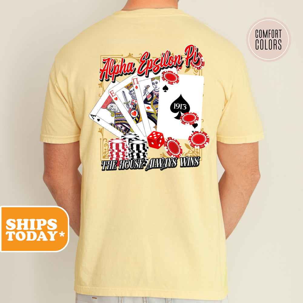 a man wearing a t - shirt with a picture of playing cards on it