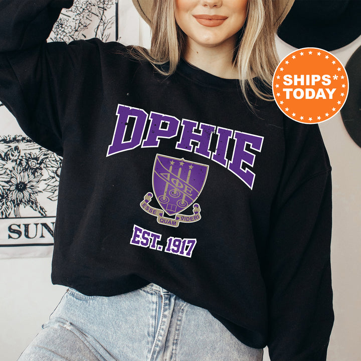 a woman wearing a black sweatshirt with purple letters on it