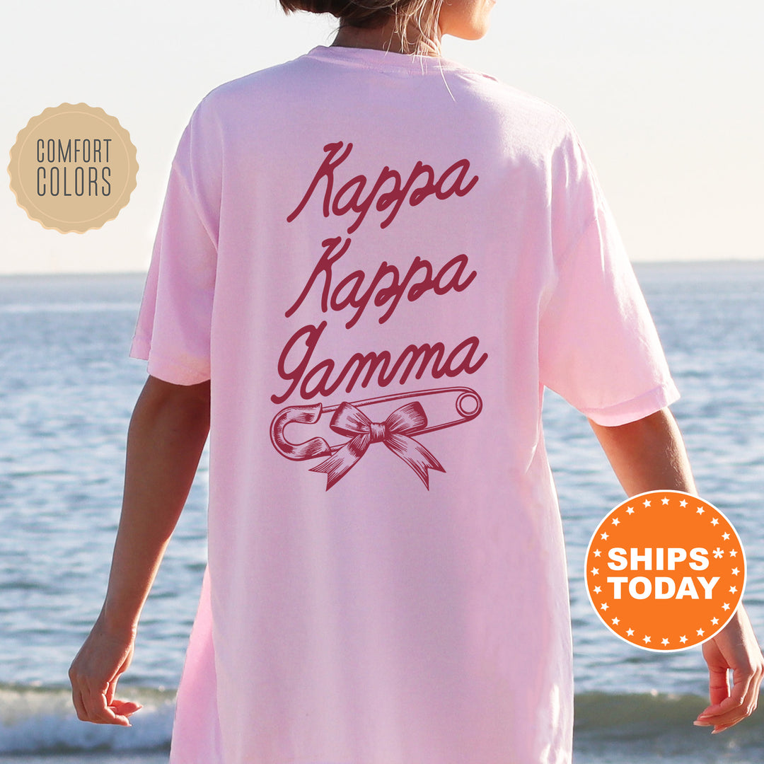 a woman wearing a pink shirt that says kapa kapa kapa yamma