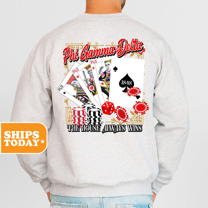 a man wearing a sweatshirt with a back print of playing cards