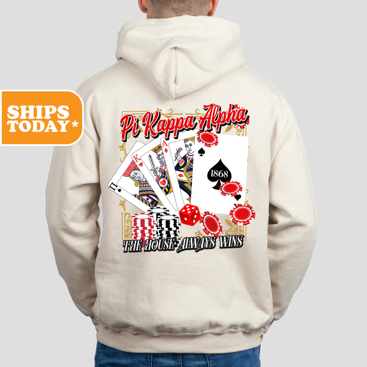 a man wearing a white hoodie with a back print of playing cards