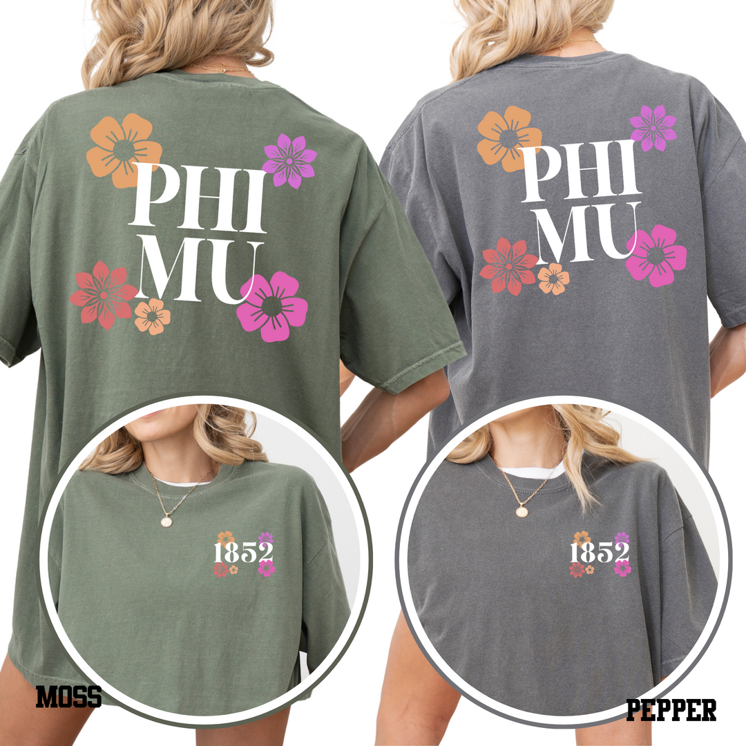 two women wearing t-shirts with floral designs and text on the back.