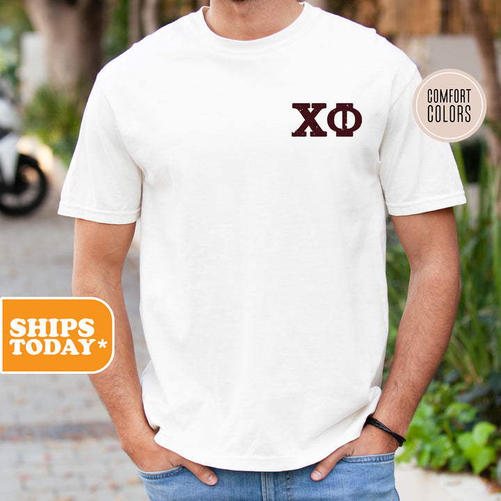 a man wearing a white shirt with the letters xo on it