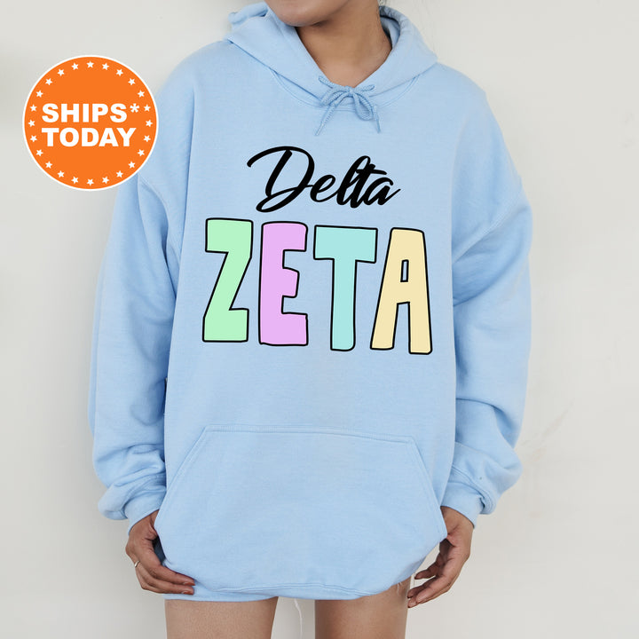 a person wearing a blue hoodie that says delta zeta