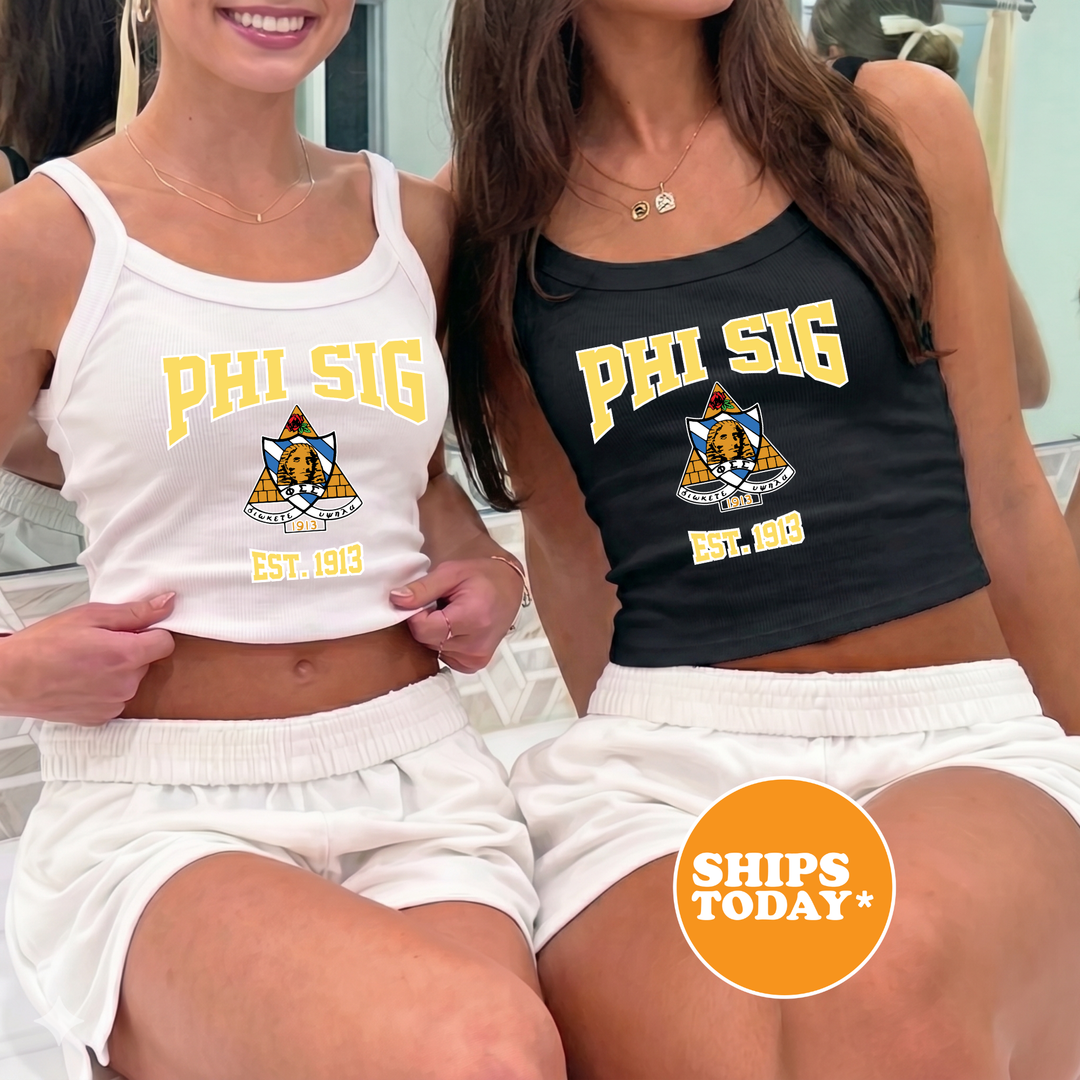 Two women wearing tank tops with the text "Phi Sig" printed on them, posing together.