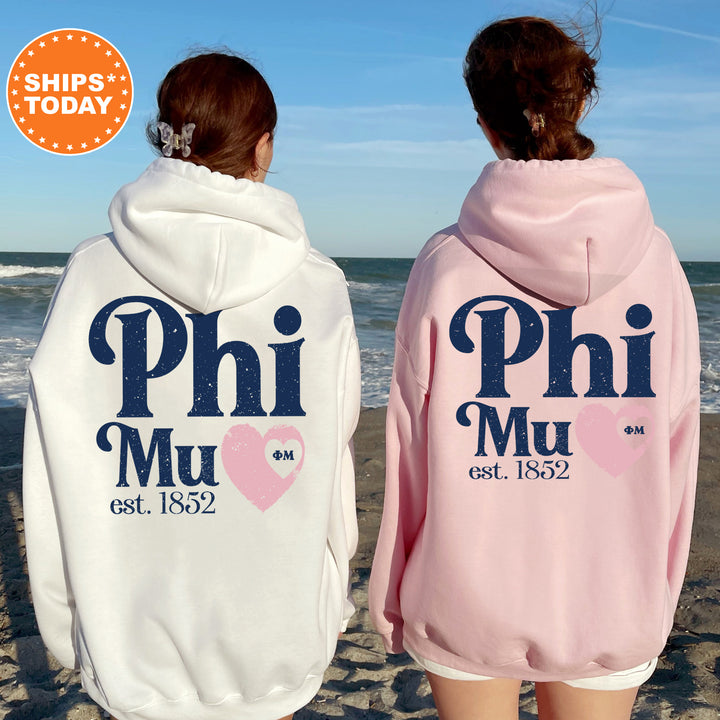 a couple of people that are standing in the sand
