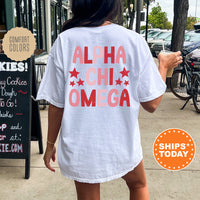 a woman walking down a sidewalk while wearing a white shirt