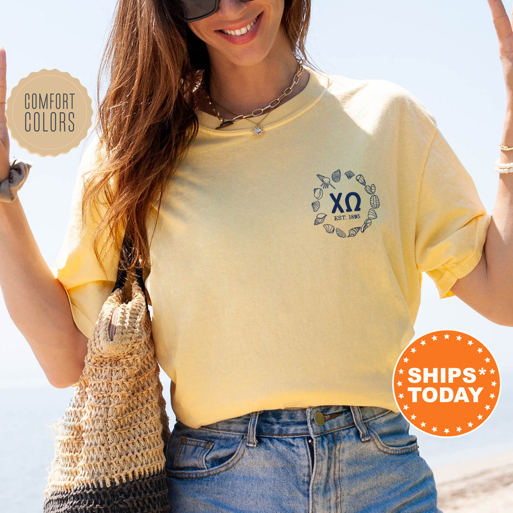 a woman in a yellow shirt holding up a peace sign