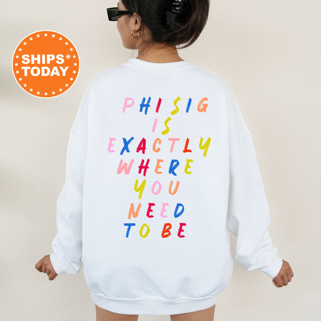 a woman wearing a sweatshirt that says phi sig exactly where you need to be