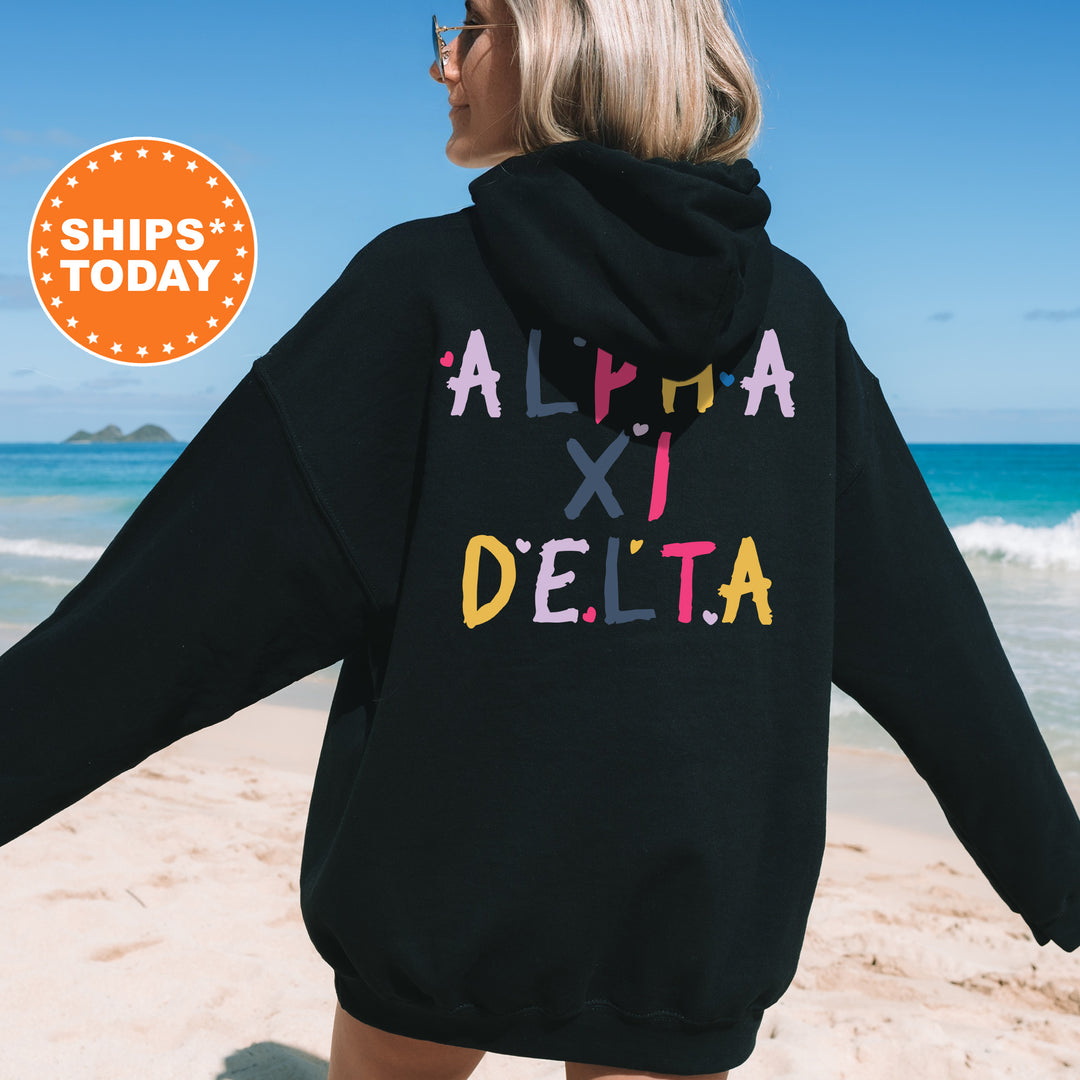 a woman wearing a black hoodie with the word delta printed on it