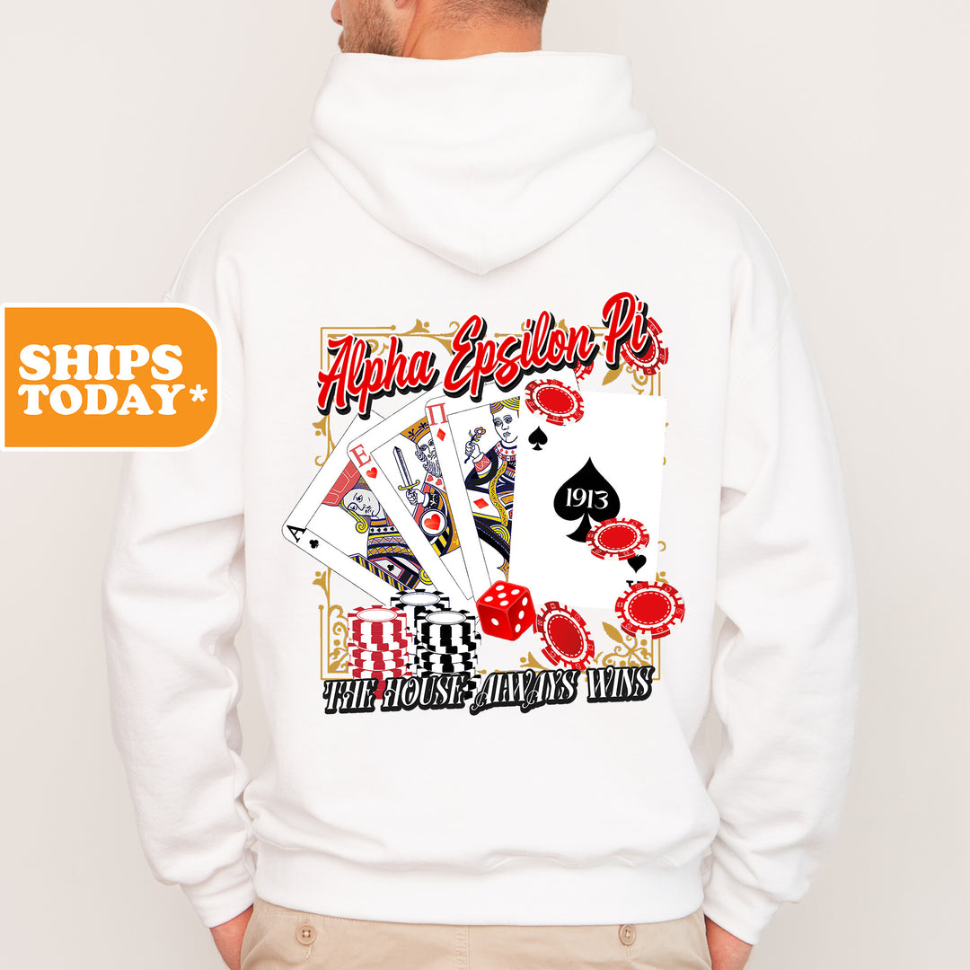 a man wearing a white hoodie with a picture of playing cards on it