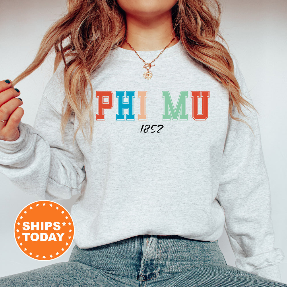 a woman with long hair wearing a sweatshirt that says phiimu