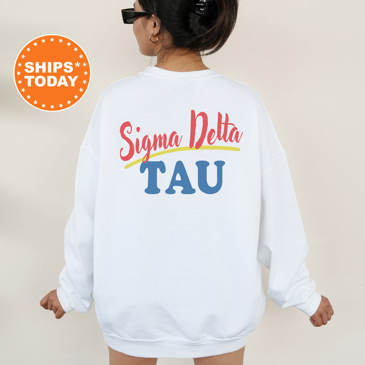 A person wearing a white sweatshirt with the text " Sigma Delta TAU" printed on the back.