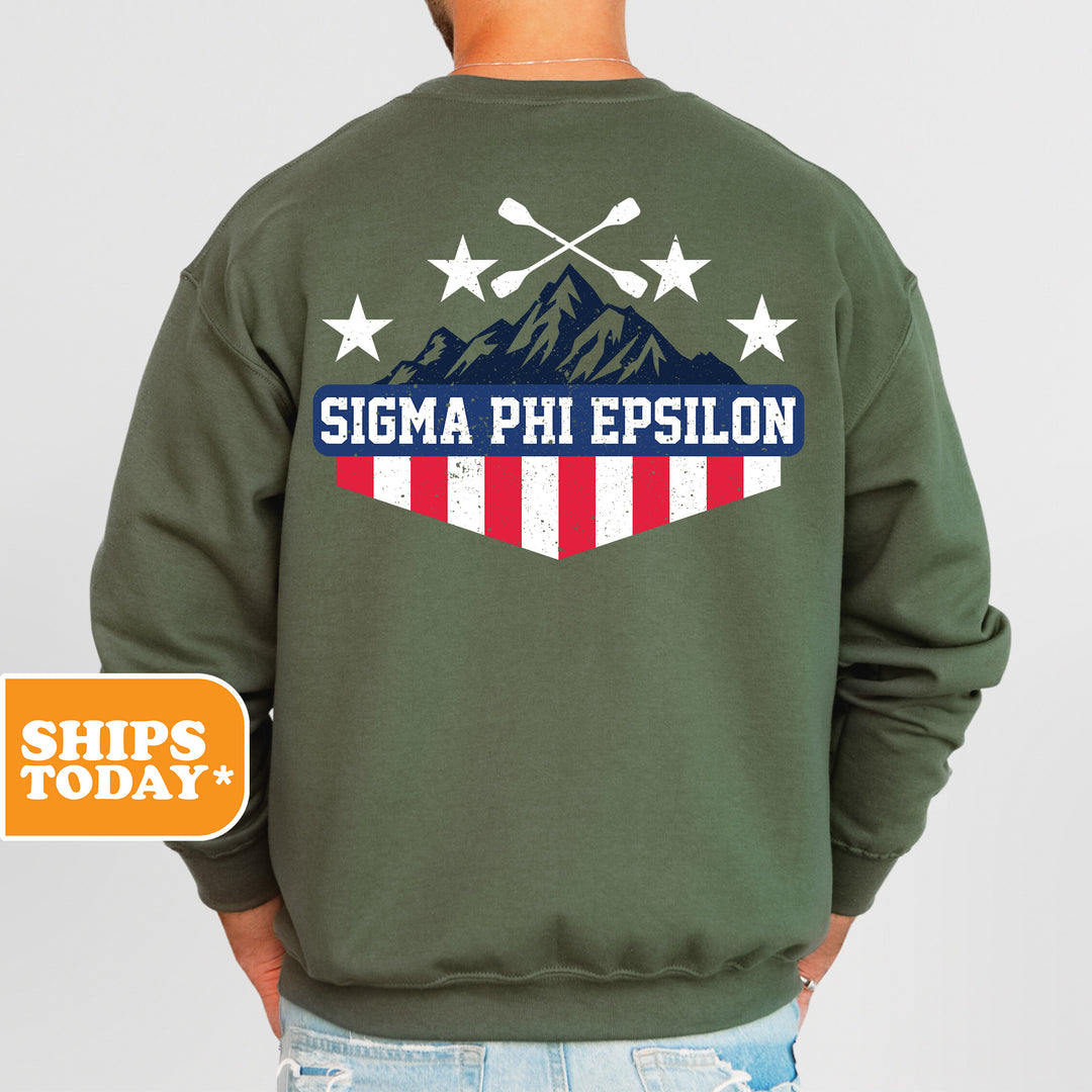 a man wearing a green sweatshirt with an american flag on it