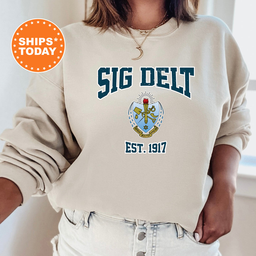 a woman wearing a sweatshirt that says sig delt est 1917