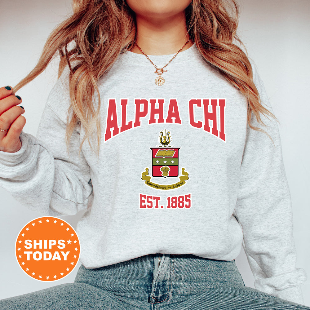 a woman wearing a sweatshirt with a crest on it