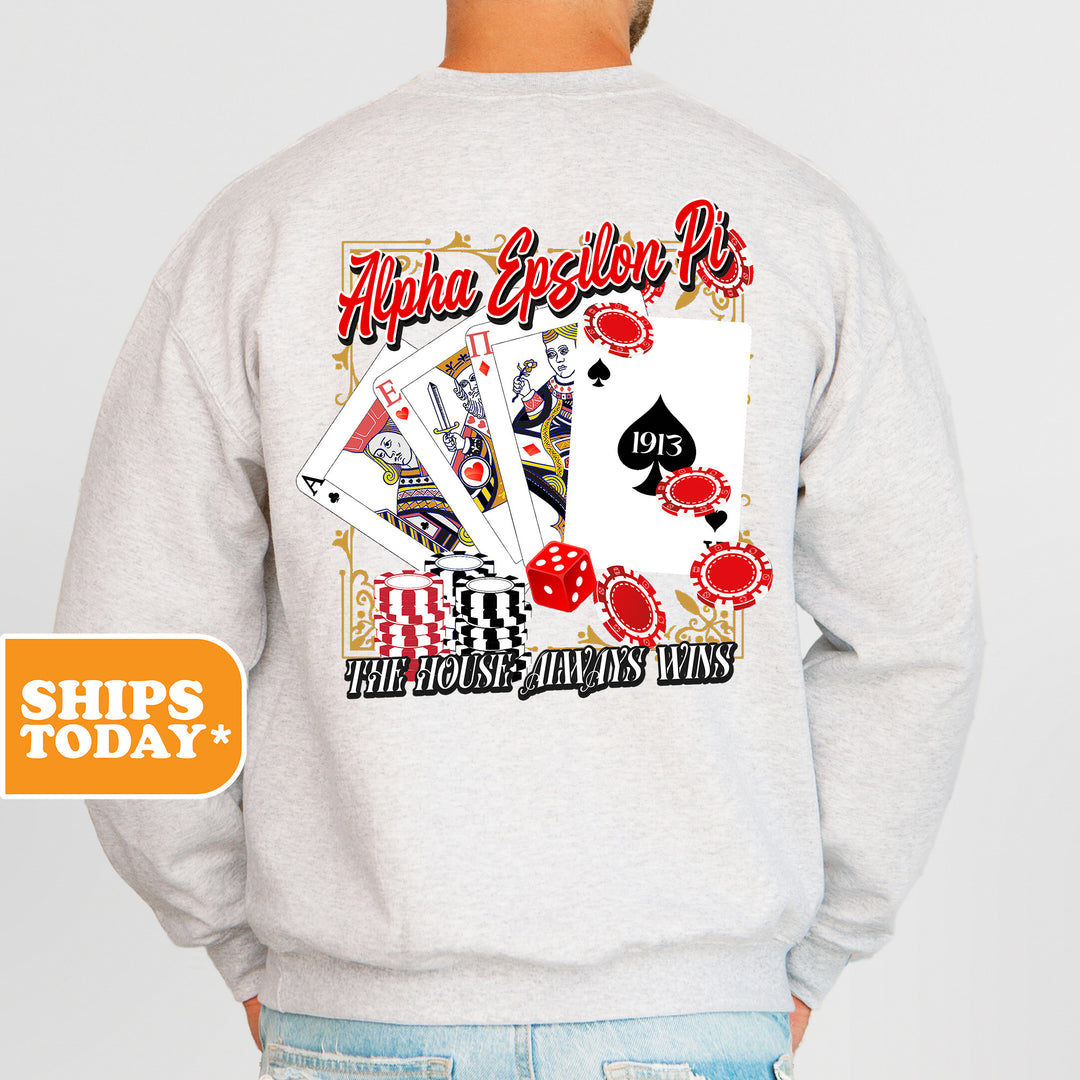 a man wearing a sweatshirt with a back print of playing cards