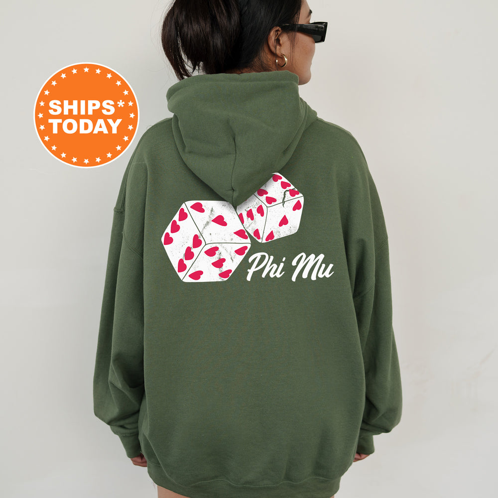 a woman wearing a green hoodie with a pair of dice on it