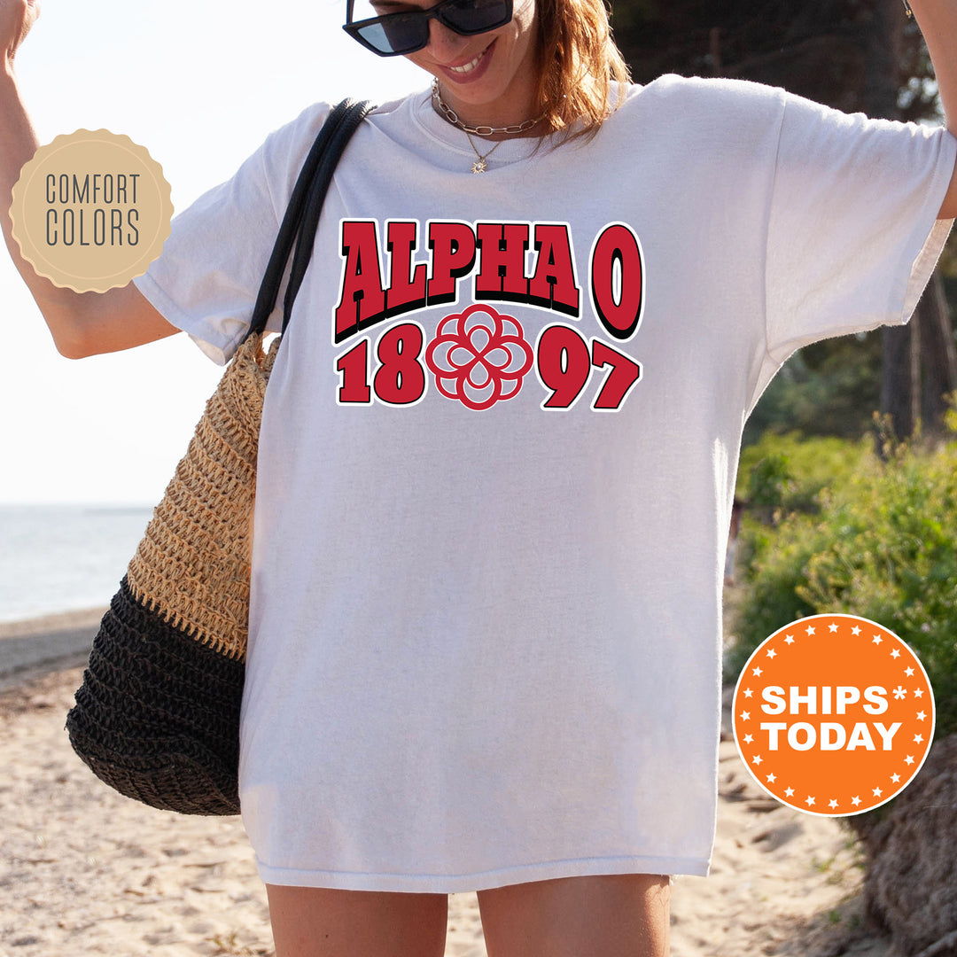 a woman wearing a white shirt with the words alpho on it