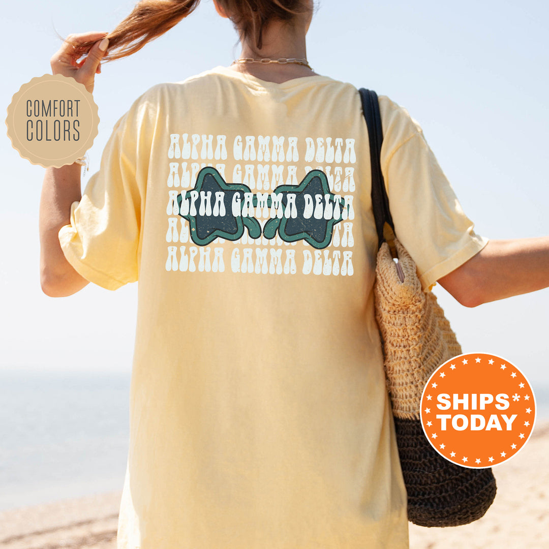a woman walking on a beach holding a purse