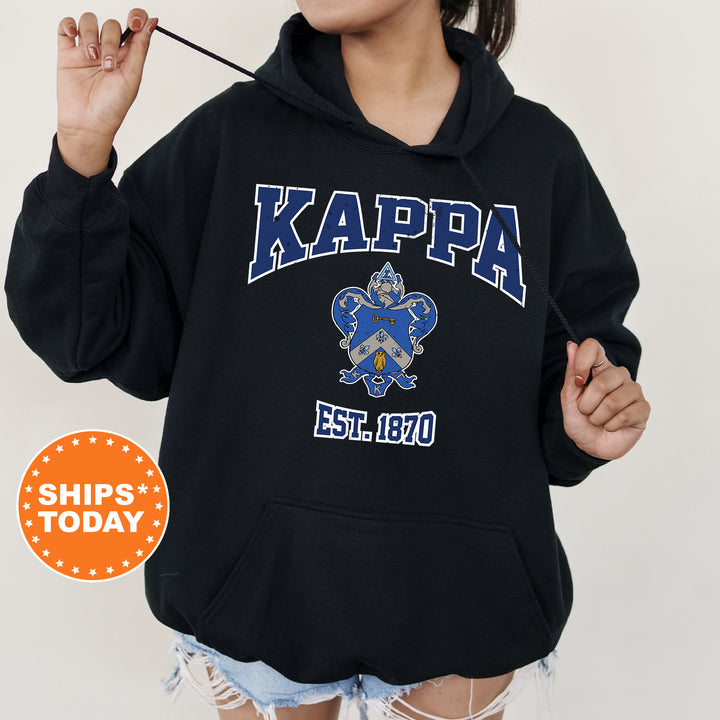 a girl in a black hoodie holding a toothbrush